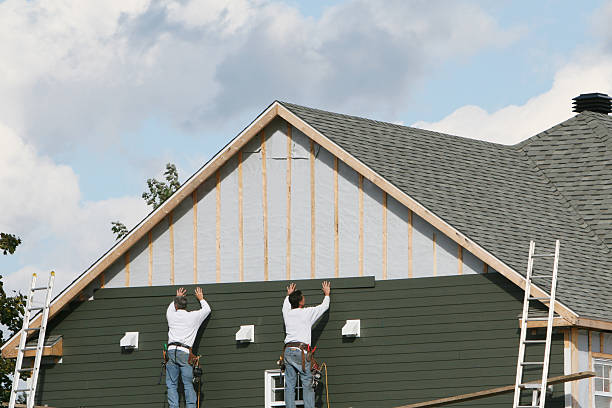 Professional Storm Damage Siding Repair technician working in Smicksburg, PA